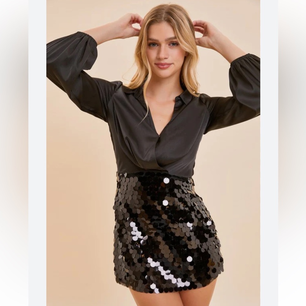 Black cocktail dress with satin bodice and black disc skirt